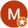 small burnt orange circle with a white, uppercase letter "M" with smaller orange inset circle containing a white star.